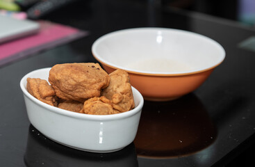 A picture of fried beans cake and garri

