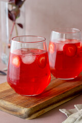 Strawberry lemonade on a pink background . Cold drinks. Summer. Recipe.
