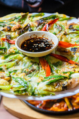 Fototapeta na wymiar korean pizza with vegetables and sea food