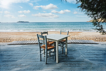 Lesbos island, Greece - A beautiful seat in the Aegean Sea on the island of Lesvos, facing the sea. Romantic dinner in the restaurant on holidays. Greece tavern. 