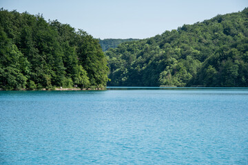 Fototapeta premium Picturesque morning in Plitvice National Park. Colorful spring scene of green forest with pure water lake. Great countryside view of Croatia, Europe