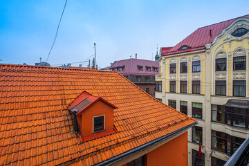 Traditional architecture of Old town of Riga, Latvia. Close-up of red tile roof. Modern exterior.