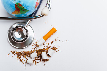 Fototapeta premium broken pile cigarette or tobacco and doctor stethoscope