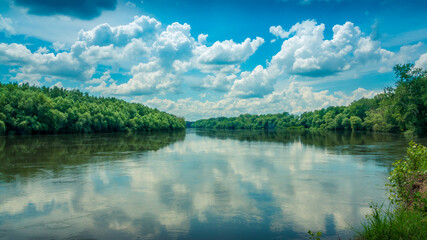 Wide River with Blue skies and white clouds
