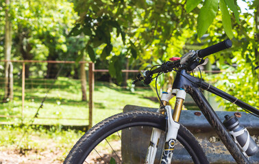 closeup mountain bike with soft-focus in the background. over light
