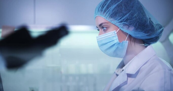 Female doctor working in laboratory. Studying medical samples