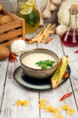 Potato soup with cream and smoked horsemeat