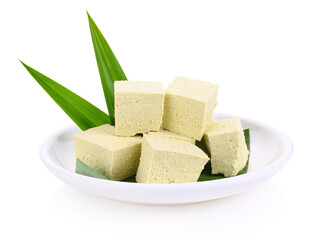 Homemade tofu with pandan leaves on white background
