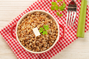 Buckwheat porridge with butter in bawl - breakfast, healthy food