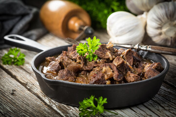 Beef stew in a cast iron skillet.