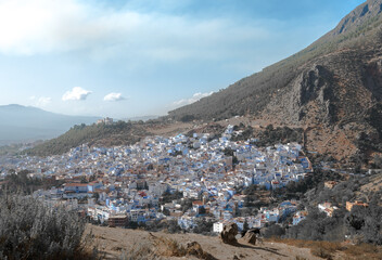 Fototapeta na wymiar Street with stairs in Medina of Chefchaouen, Morocco. Chefchaouen or Chaouen is known that the houses in this old town are painted in the striking, variously blue hued 