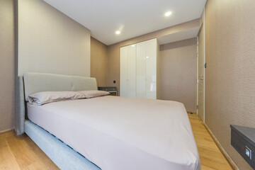 Fototapeta na wymiar Interior of cozy bedroom in modern design