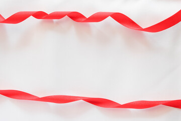 Obraz premium red ribbon on white background