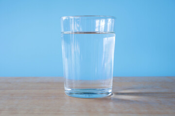 glass of water on blue background