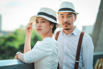 Obraz premium Outdoor portrait of bride and groom in vintage wedding costumes