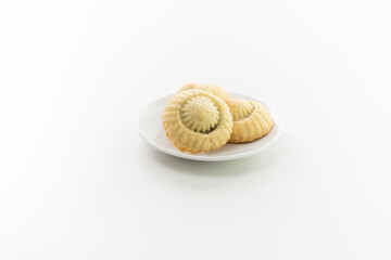 3 home made coockies on white plate, white background.