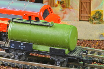 Railway tanker truck. Train hobby model on the model railway. Close-up