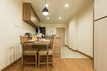 Stylish kitchen interior with dining table and chairs