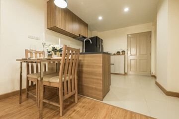 Stylish kitchen interior with dining table and chairs