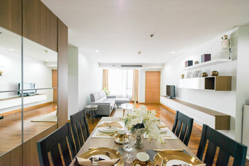 Stylish kitchen interior with dining table and chairs