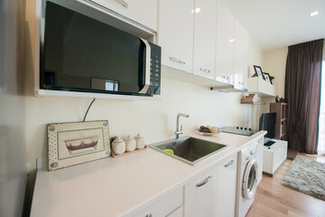 Stylish kitchen interior with dining table and chairs