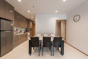 Stylish kitchen interior with dining table and chairs