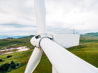 A very close-up of the rotor and wind turbine blades.