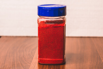 Dried paprika. Red paprika powder in a jar. Spices and ingredients for cooking