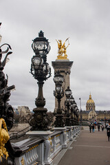 Fototapeta na wymiar Photo of Alexander III bridge in Paris during a cloudy day
