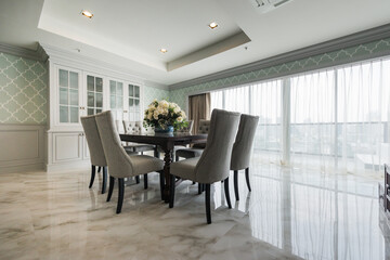 Stylish kitchen interior with dining table and chairs