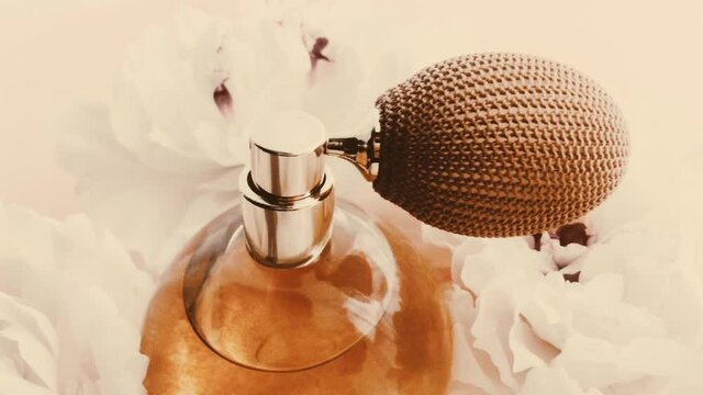 Vintage perfume bottle with peony flowers, chic fragrance scent as luxury cosmetic, retro fashion and beauty product backgrounds