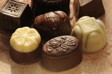 Chocolate bonbon, on a chocolate background.