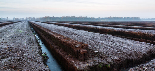 Sunrise at a peat excavation site in Northwestern Germany