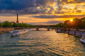 Fotobehang Sunset view of Eiffel tower and Seine river in Paris, France. Eiffel Tower is one of the most iconic landmarks of Paris. Cityscape of Paris © Ekaterina Belova