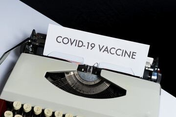 Covid-19 Vaccine on a typewriter