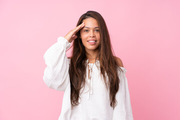 Young Brazilian girl over isolated pink background has just realized something and has intending the solution