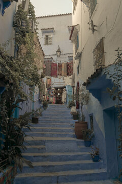 Street with stairs in Medina of Chefchaouen, Morocco. Chefchaouen or Chaouen is known that the houses in this old town are painted in the striking, variously blue hued
