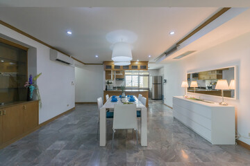 Obraz premium Stylish kitchen interior with dining table and chairs