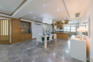 Stylish kitchen interior with dining table and chairs