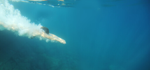 Woman swimming underwater