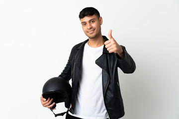 Man with a motorcycle helmet isolated on white background with thumbs up because something good has happened