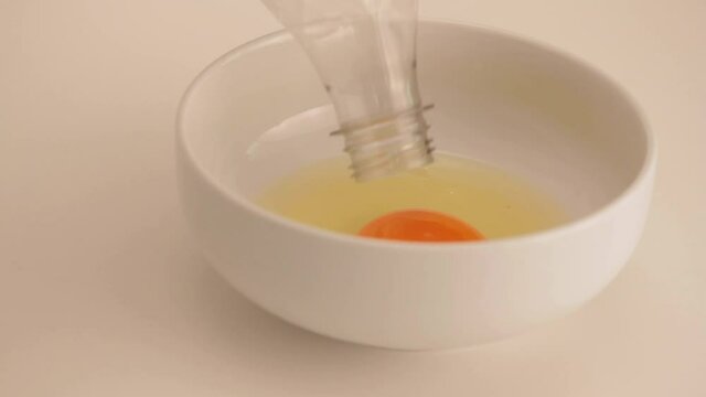 taking the yolk with a plastic bottle