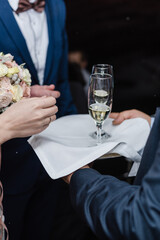 champagne glasses on a tray, newlyweds meeting