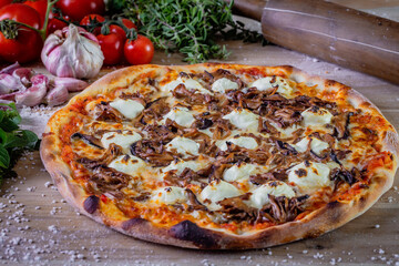 Shimeji mushroom and cream cheese pizza and cooking ingredients: tomatoes, basil, garlic on wood table background.