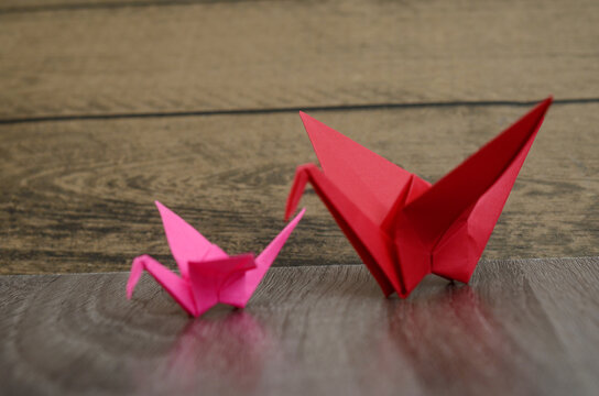 origami bird on wooden background