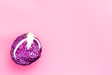 Red cabbage - head, cross section - on pink background top view space for text