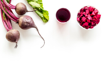 Beet - slices, fresh juice, green tops - from above copy space