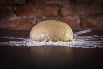 Fresh raw dough for pizza ready to be prepared