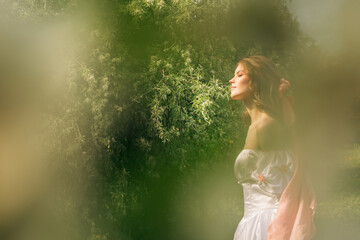 Princess walking in flowering garden