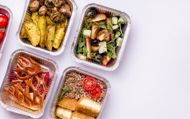 Food delivery. Dishes for dinner porridge, salad, potatoes with mushrooms on a white background. Copy space